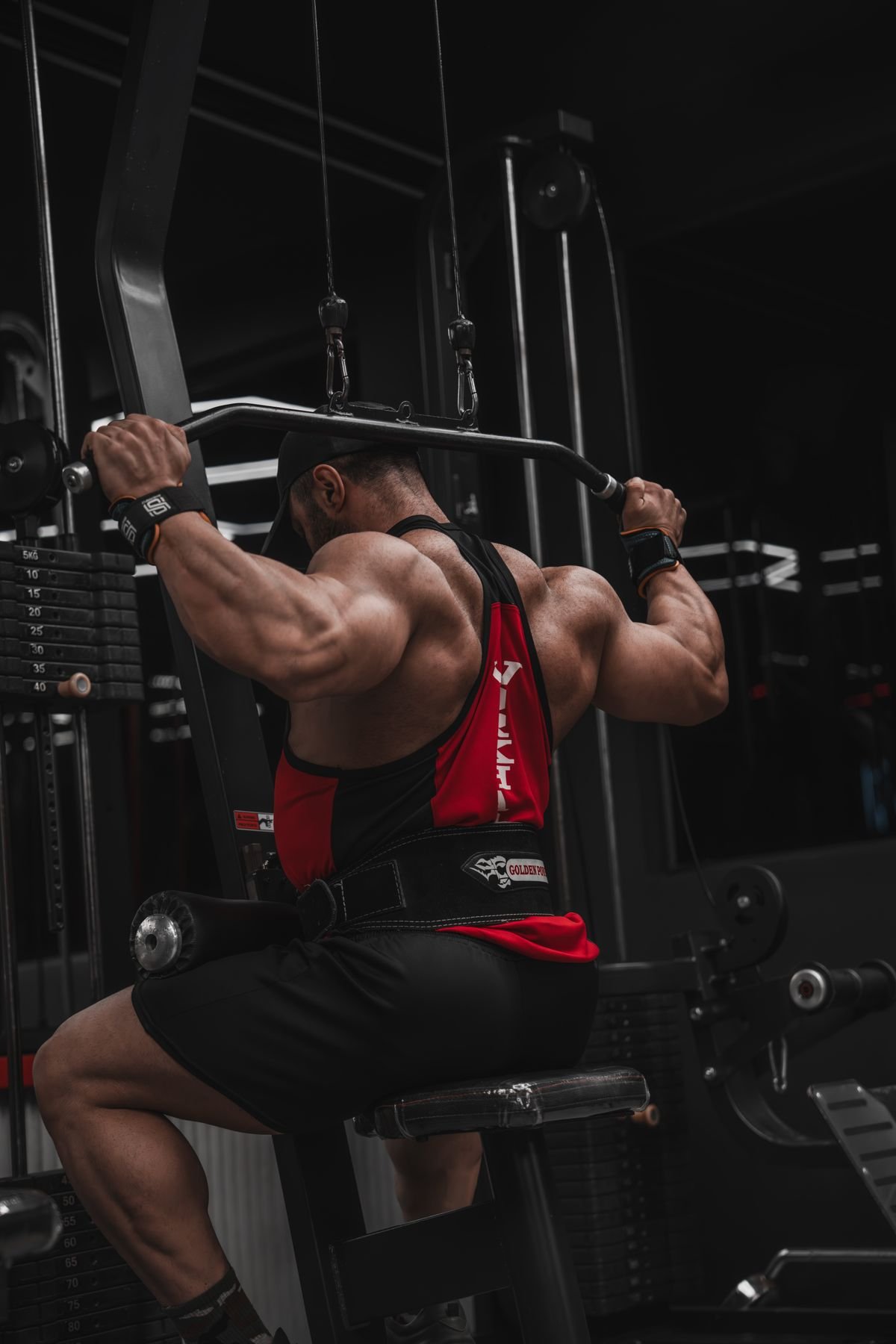 Man performing a lat pulldown to strengthen the upper back muscles