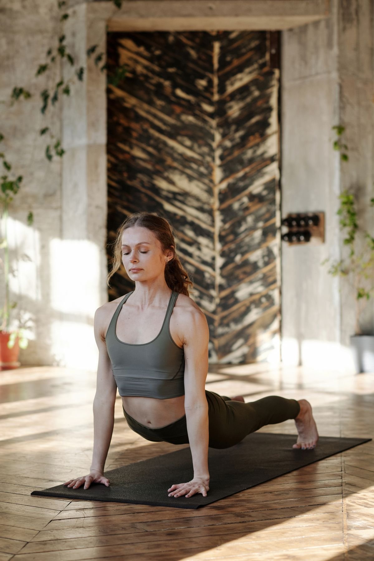 Woman stretching to improve posture and flexibility at home