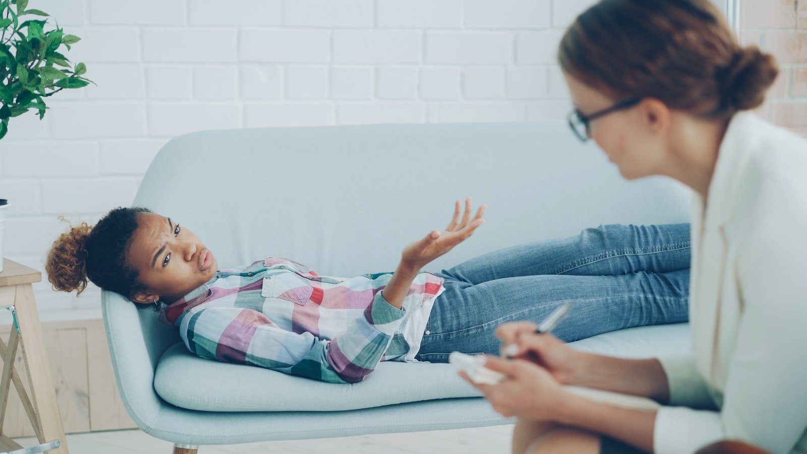 Therapist listening attentively to a client during a counseling session