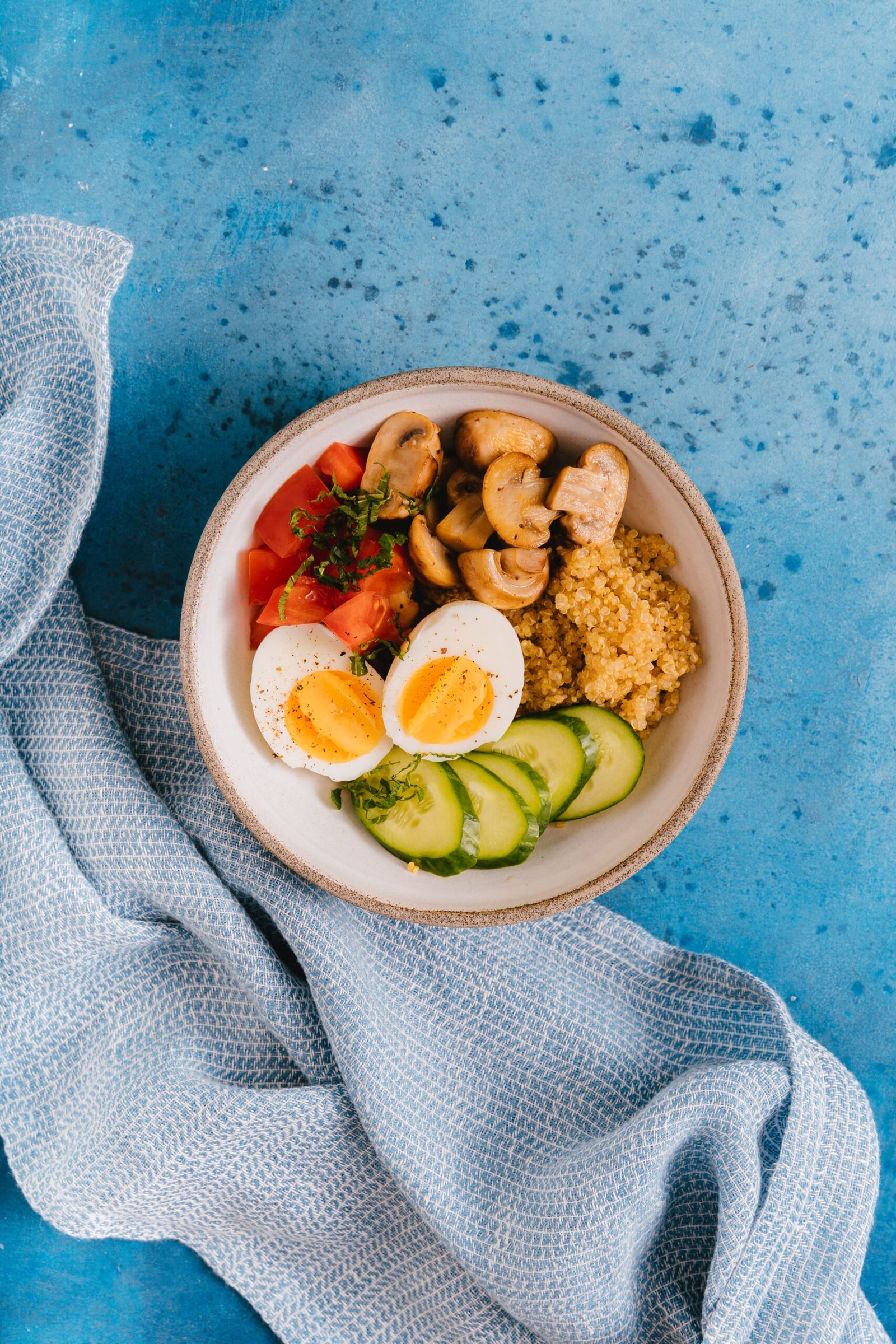 Bowl of vegetables, grains, and eggs representing a heart-healthy diet