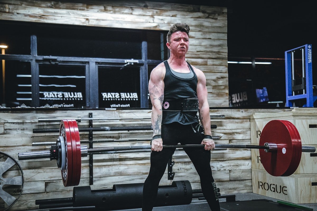 Woman lifting a barbell during a strength training session