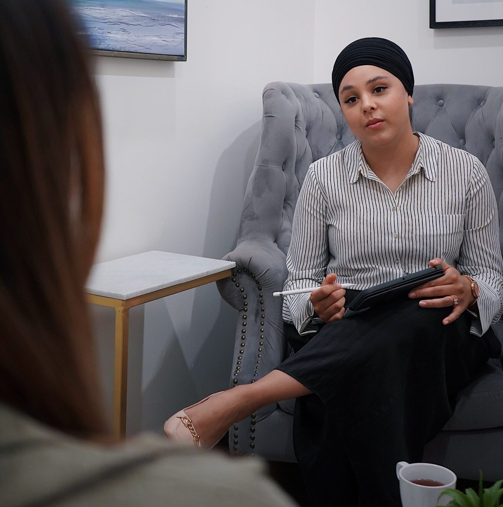 woman talking to a psychologist during a therapy session