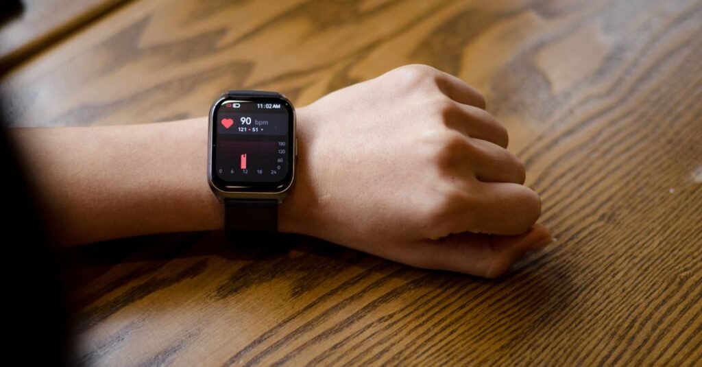 smartwatch fitness tracker displaying heart rate on a wrist