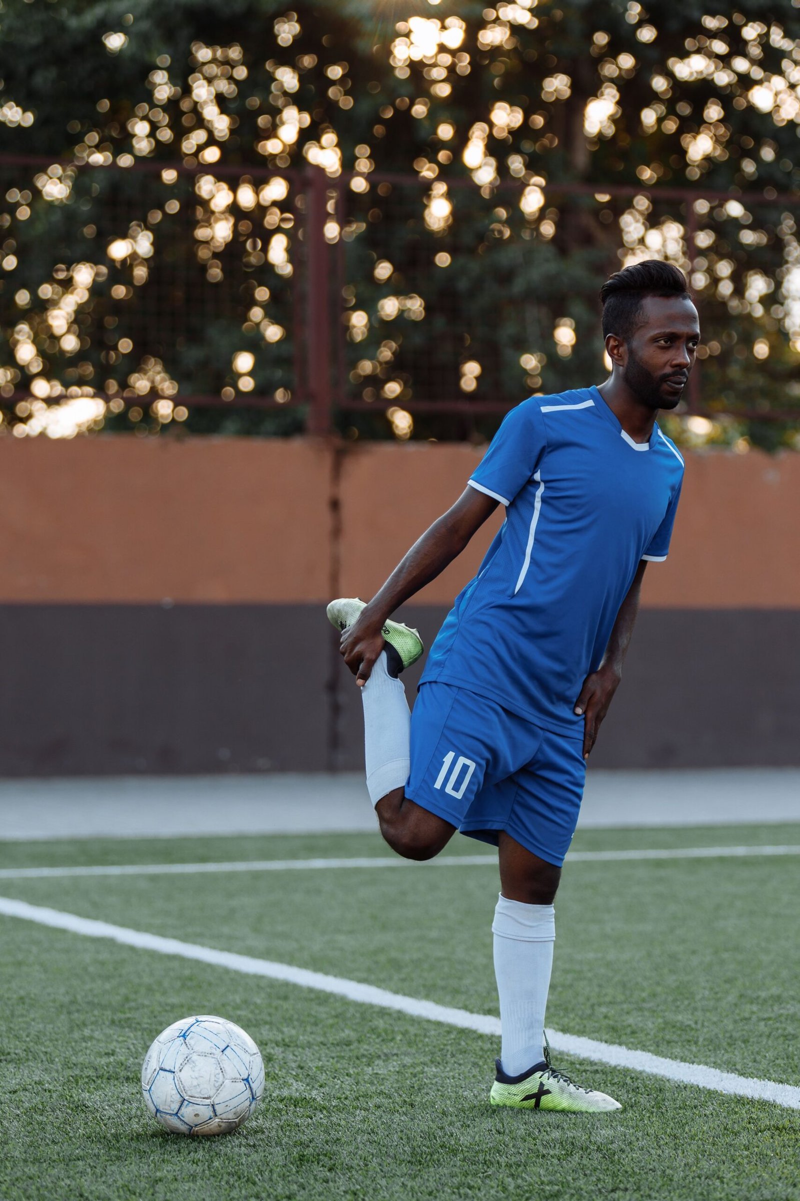 athlete stretching to help prevent ankle injury