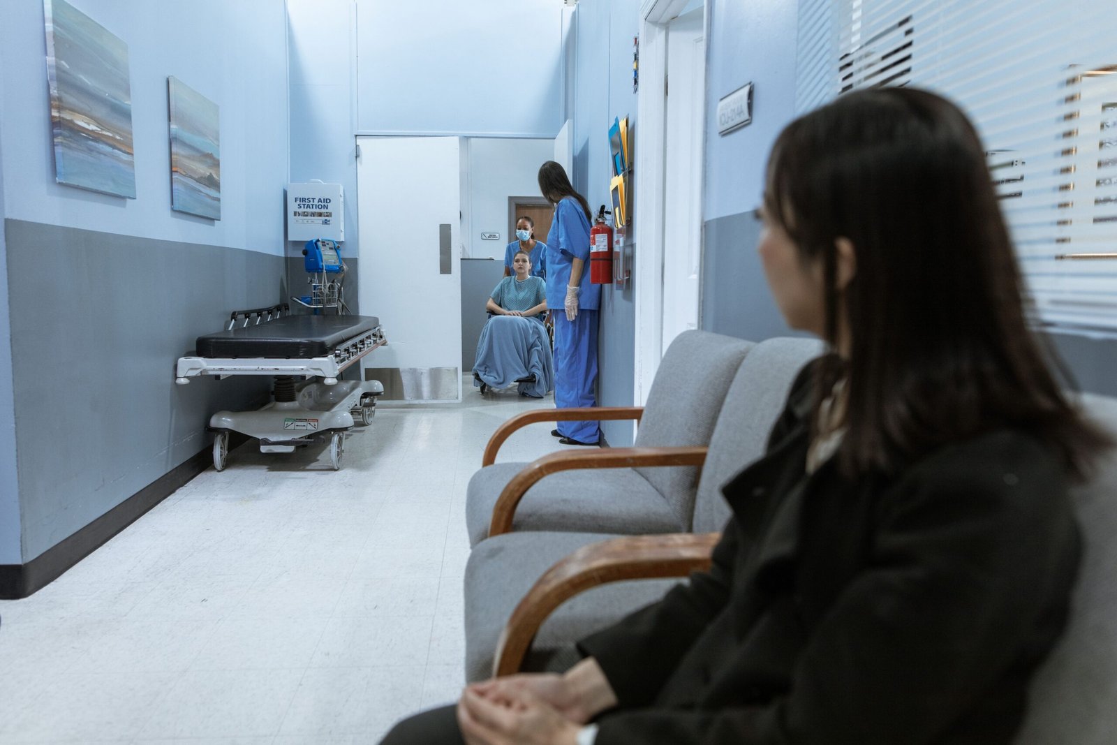 nurse pushing a patient in a bariatric wheelchair