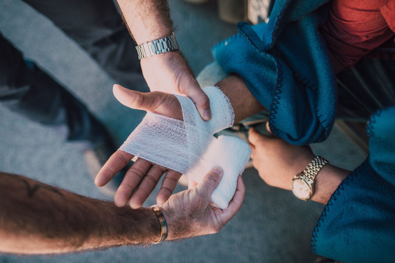 Person helping wrap a supportive wrist brace after a sprain