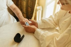 senior adults checking oxygen saturation with a pulse oximeter on the index finger