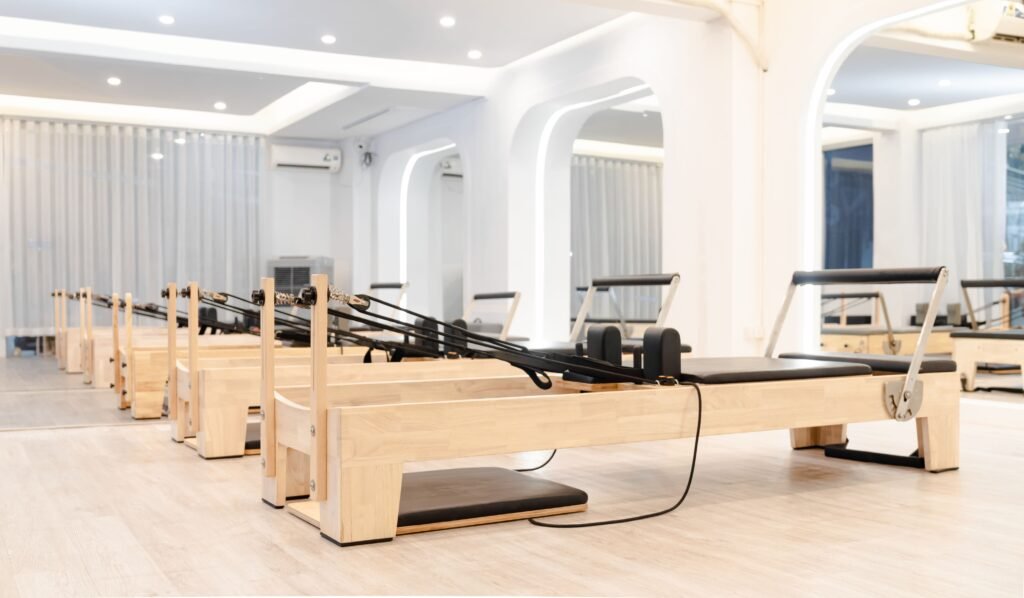 Minimalist home studio space set up for Pilates reformer workouts
