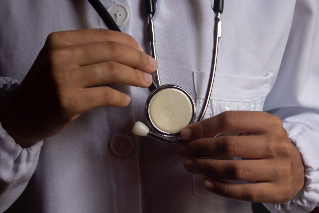 doctor holding a stethoscope with visible tubing