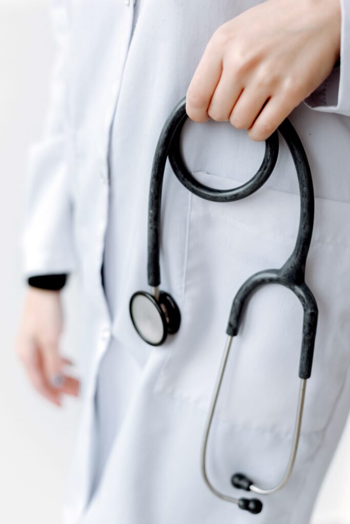 Person holding a stethoscope close-up of a person holding a stethoscope