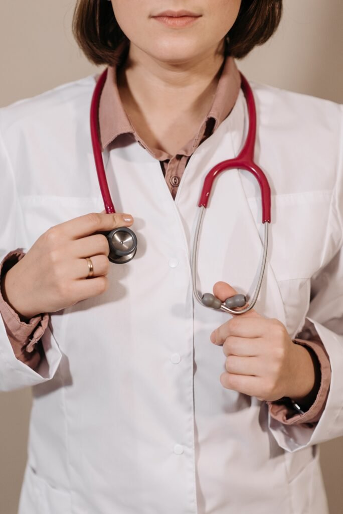 Physician wearing a stethoscope physician in a white coat wearing a stethoscope