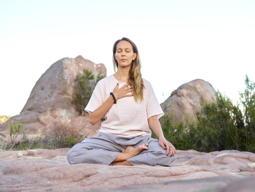 woman meditating to manage stress and blood pressure