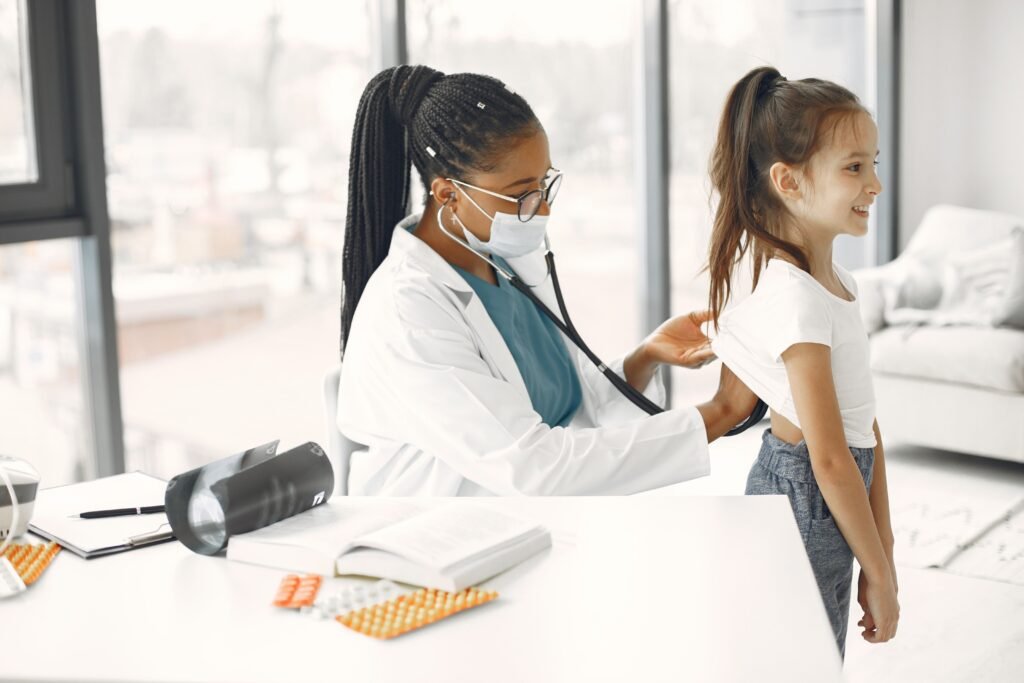 doctor examining a young patient with a stethoscope
