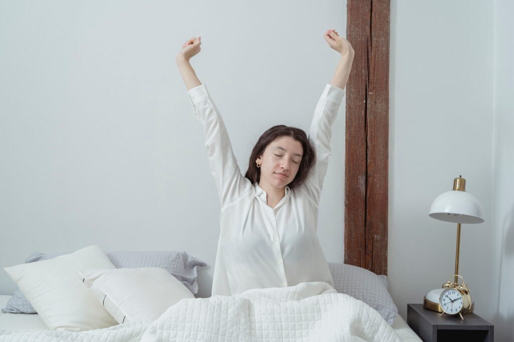 woman waking up in bed in the morning