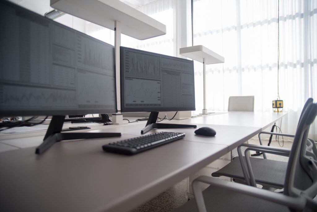 Ergonomic office desk setup with adjustable monitors for reducing eye strain
