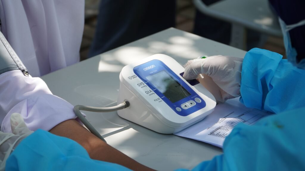 doctor checking the blood pressure of a patient