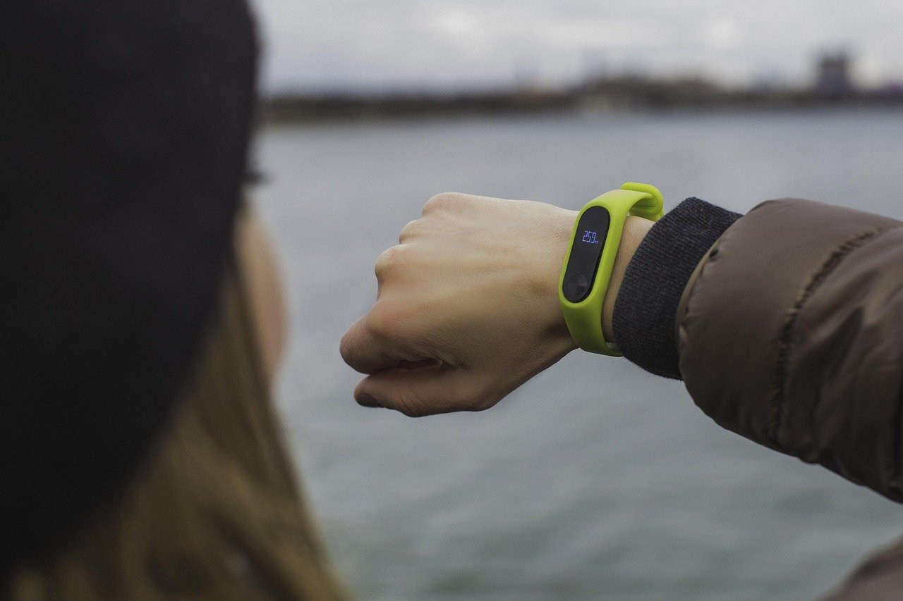 Close-up of a fitness tracker smartwatch on a wrist